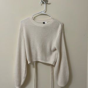 small H&M cream cropped sweater with cutout in back. Tie back. Lightly used.